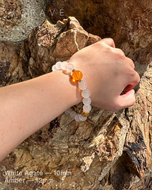 White agate and amber bracelet worn on wrist with minimalist style