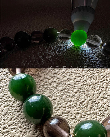Close-up of green jasper beads showing forest-inspired colors and stone texture