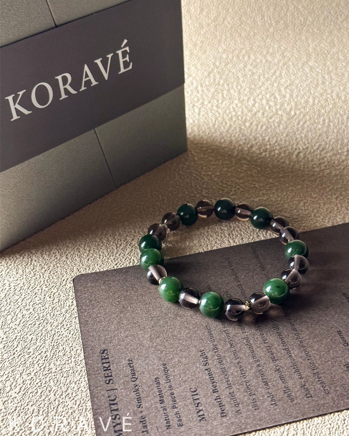 Green jasper and smoky quartz bracelet presented in elegant packaging with natural simplicity