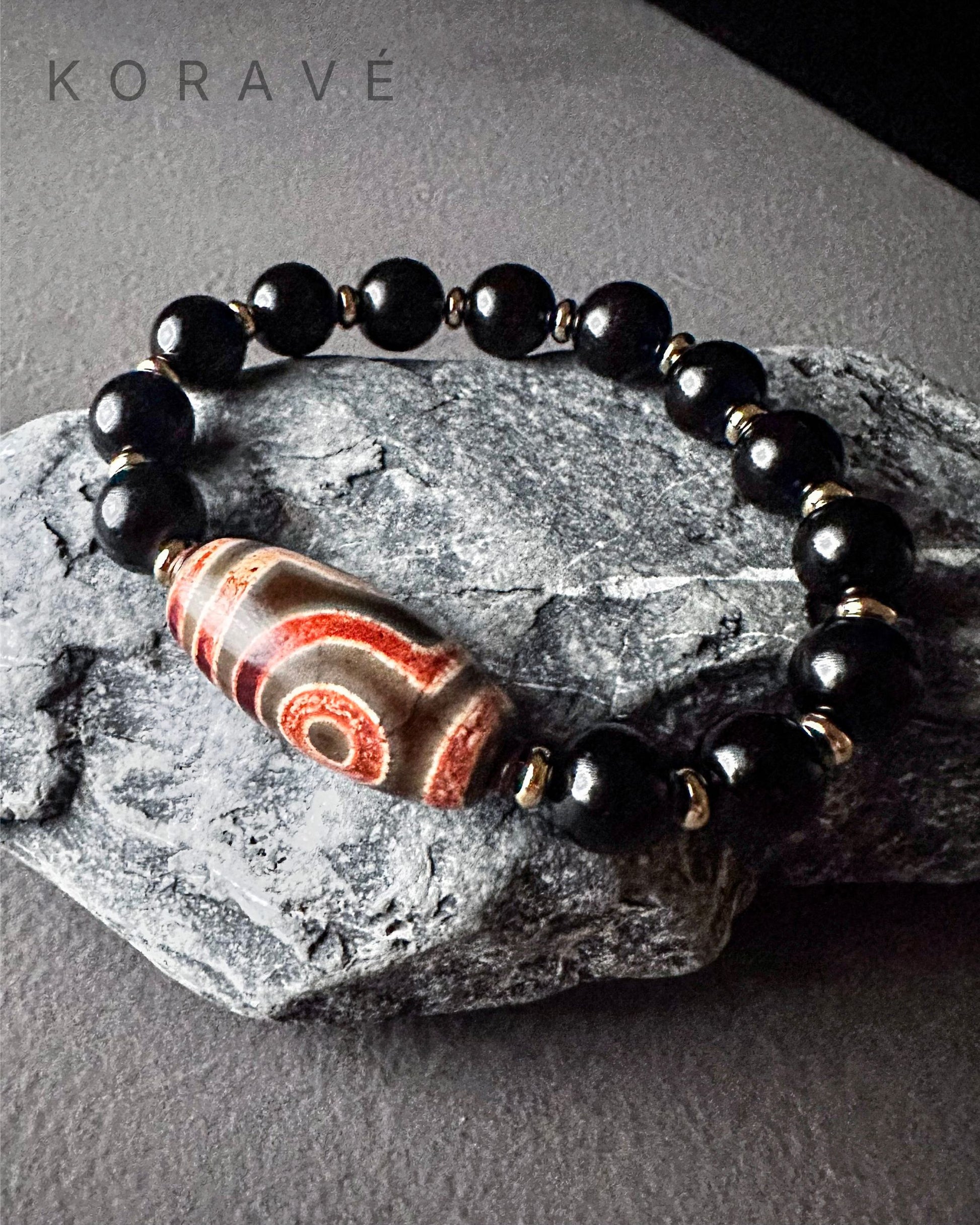 KORAVÉ minimalist obsidian bracelet product showcase with Tibetan inspired design
