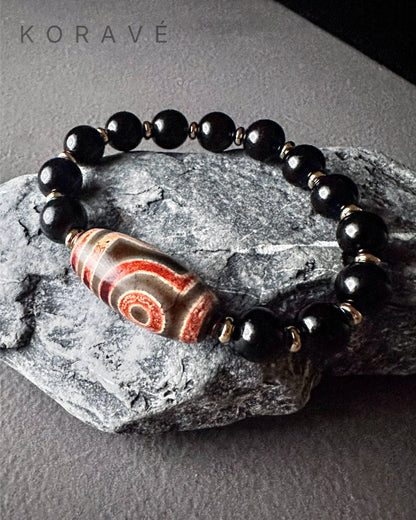 KORAVÉ minimalist obsidian bracelet product showcase with Tibetan inspired design