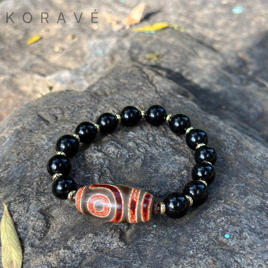 Natural obsidian Tibetan bracelet with Dzi bead inspired design by KORAVÉ