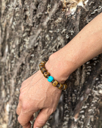 Handmade yak bone bracelet worn on wrist featuring Tibetan heritage elements