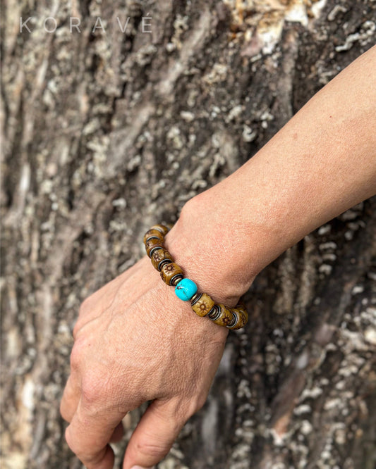 Handmade yak bone bracelet worn on wrist featuring Tibetan heritage elements